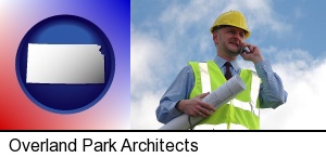 an architect with blueprints, conversing on a cellular phone in Overland Park, KS